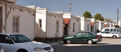 Rear of Larger Apartments and Adjacent Parking image. Click for full size.