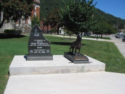 Memorials in front of the Courthouse. Click for full size. Memorials in front of the Courthouse image. Click for full size.