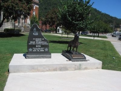 Memorials in front of the Courthouse image. Click for full size.