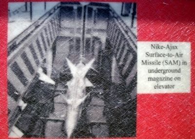 Nike–Ajax Surface-to-Air Missile (SAM) in underground magazine on elevator image. Click for full size.