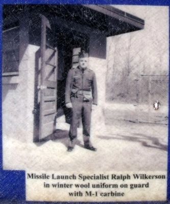 Missile Launch Specialist Ralph Wilkerson in winter wool uniform on guard with M-1 carbine image. Click for full size.
