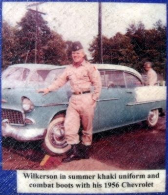 Wilkerson in summer khaki uniform and combat boots with his 1956 Chevrolet image. Click for full size.