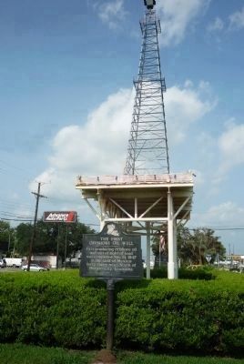 First Offshore Oil Well Marker and replica oil derrick image. Click for full size.
