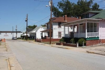 John McClinton Tutt Marker and house as seen looking north along Phillips Street image. Click for full size.