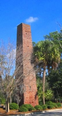 Brick chimney from brickmaking facility image. Click for full size.
