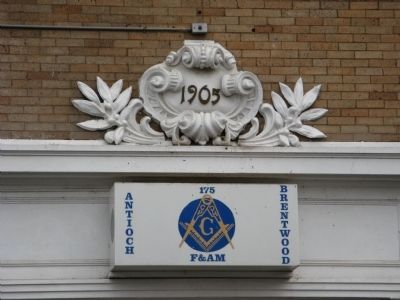 Sign and Architectural Detail Above Entrance Door image. Click for full size.