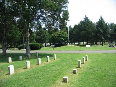 Flagpole and Memorials in the Cemetery. Click for full size. Flagpole and Memorials in the Cemetery image. Click for full size.