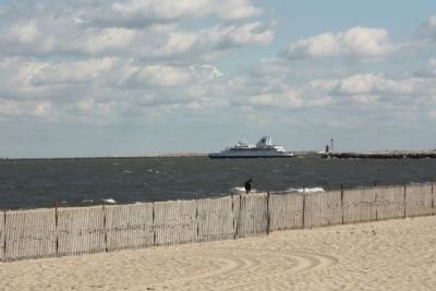 Cape May- Lewes Ferry seen along with Breakwater East End Lighthouse in background. Click for full size. Cape May- Lewes Ferry seen along with Breakwater East End Lighthouse in background image. Click for full size.