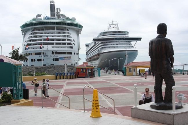 Dr Albert Claudius ("Claude") Wathey Marker and statue greet the Cruise ships in port image. Click for full size.