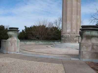 Bronze plaques along the rim of the wall. Click for full size. Bronze plaques along the rim of the wall image. Click for full size.