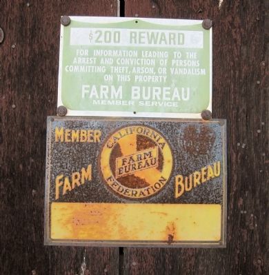 California Farm Bureau Signs mounted on shop front to the left of the door image. Click for full size.