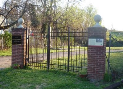 Woodlawn Cemetery Marker on gate post at right image. Click for full size.