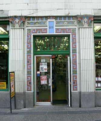 Power Block - front entrance decorated with colored terra cotta image. Click for full size.