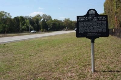 Turpentine Industry Community and Family Marker seen looking southwest along State Road 24 image. Click for full size.