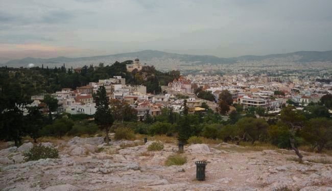 View toward central Athens from Areopagus Hill, a high rock outcrop in Parko Thiseio image. Click for full size.