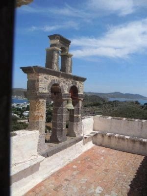 Roof of the Apocalypse Monastery with Patmos harbor in the background image. Click for full size.