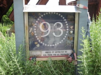 Pieces of United Flight 93 and soil from the U.S. Pentagon image. Click for full size.