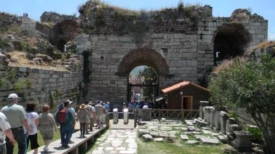 The Basilica of St. John - visitors exiting the ancient ruins via the Roman portal to the south image. Click for full size.