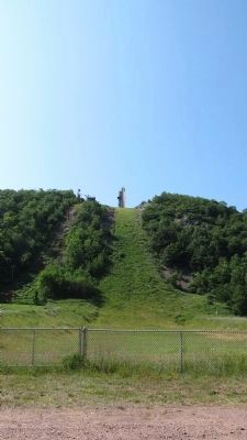 From base of hill looking up to ski jump. image. Click for full size.