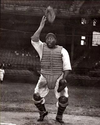 Negro League baseball catcher Josh Gibson throwing mask into air image. Click for full size.