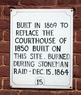 Sign on Courthouse Wall image. Click for full size.
