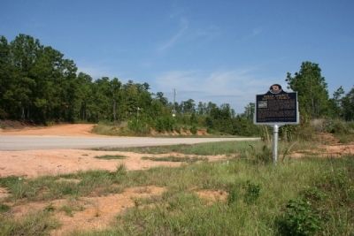 The dirt road across from the marker is the road to Indian Springs Baptist Church image. Click for full size.