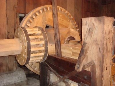 Wooden gears turned by the waterwheel image. Click for full size.