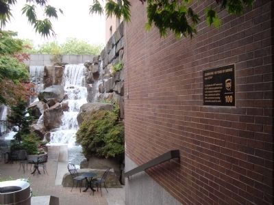 Celebrating 100 years of Service Marker located in Waterfall Garden image. Click for full size.