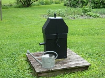 Water pump with a crank handle. image. Click for full size.