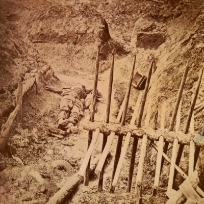 Dead Confederate soldier, in trenches of Fort Mahone in front of Petersburg, Va., April 3, 1865 image. Click for full size.