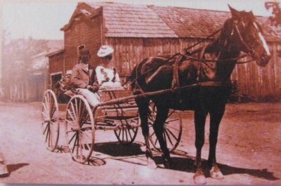 Close up of photo on marker, with the stable in the background image. Click for full size.