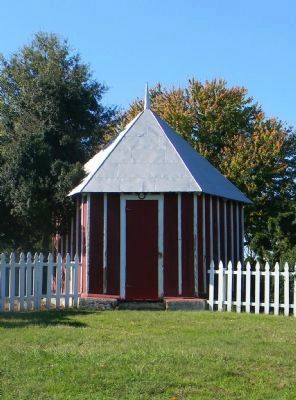 The hexagonal outbuilding and boxwood trees referred to in the text. image. Click for full size.