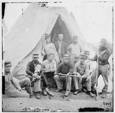 Group of soldiers of Company G, 71st New York Vols. In front of 'Sibley" tent image. Click for full size.