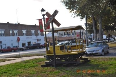 Railroad Crossing sign in front of Train Depot image. Click for full size.
