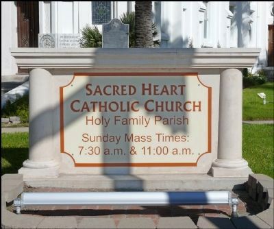 Sacred Heart Church Sign With Marker Behind image. Click for full size.