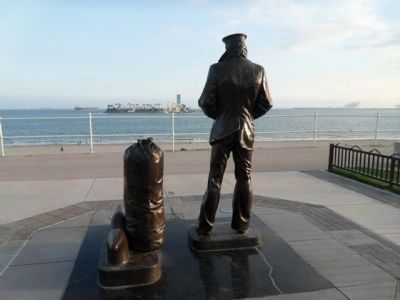 Lone Sailor overlooking the ocean. image. Click for full size.