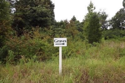 Sign pointing toward graves image. Click for full size.