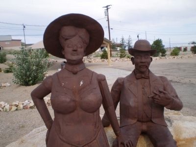 Welded steel sculpture of Jim and Belle Butler image. Click for full size.