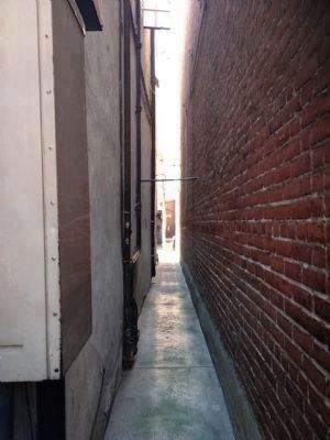 Alley to The Canary Cottage & <br> Pan Tan Gambling House image. Click for full size.