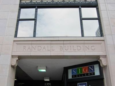 Randall Building - terra cotta paneling with building name image. Click for full size.
