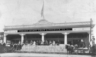 Lee Bros. Building with Fruit Boxes Ready for Shipping Stacked on Sidewalk image. Click for full size.