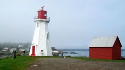 Mulholland Point Lighthouse, with Lubec, Maine in background image. Click for full size.