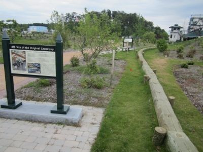 Timbers mark the course of the colonial causeway.. Click for full size. Timbers mark the course of the colonial causeway. image. Click for full size.