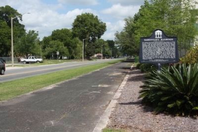 Gainesville's Railroads / Past Railroads of Gainesville Marker, looking north along old railbed. Click for full size. Gainesville's Railroads / Past Railroads of Gainesville Marker, looking north along old railbed image. Click for full size.