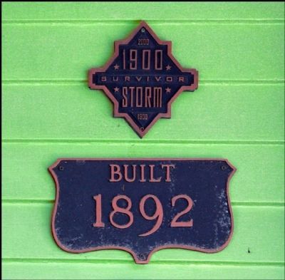 Plaques Indicating When the House Was Built & Than it Survived the 1900 Galveston Storm. Click for full size. Plaques Indicating When the House Was Built & Than it Survived the 1900 Galveston Storm image. Click for full size.