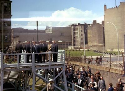 President John F. Kennedy and party at the Berlin Wall-Checkpoint Charlie, 1963. Click for full size. President John F. Kennedy and party at the Berlin Wall-Checkpoint Charlie, 1963 image. Click for full size.