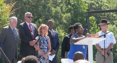 Community officials and UCAAC coordinators at the podium, June 16, 2012 image. Click for full size.