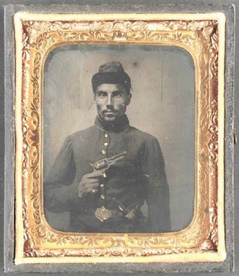 African American soldier, half-length portrait, with pistol and jacket image. Click for full size.