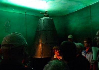 Tourists examine a 17th Century diving bell on display in the museum image. Click for full size.