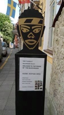 Welcome signage adjacent to the <i>Mustpeade Maja</i> image. Click for full size.